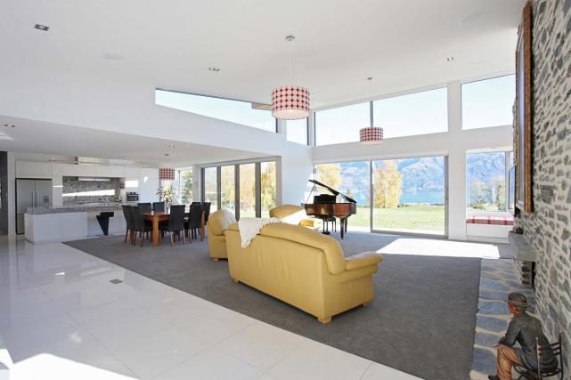 8. Open area lounge dining and kitchen with view