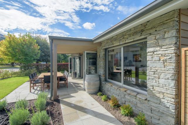 pathway to sliding doors front of cottage