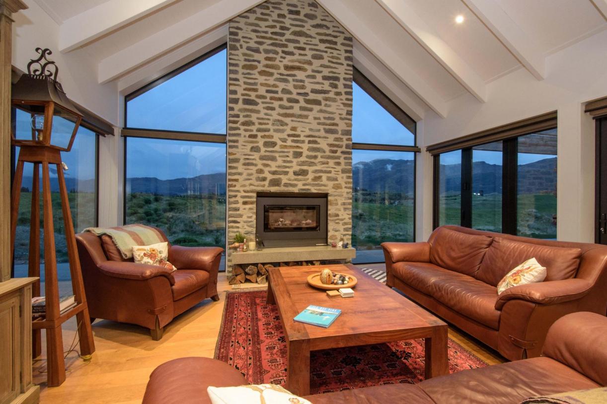 Lounge with stone chimney fireplace